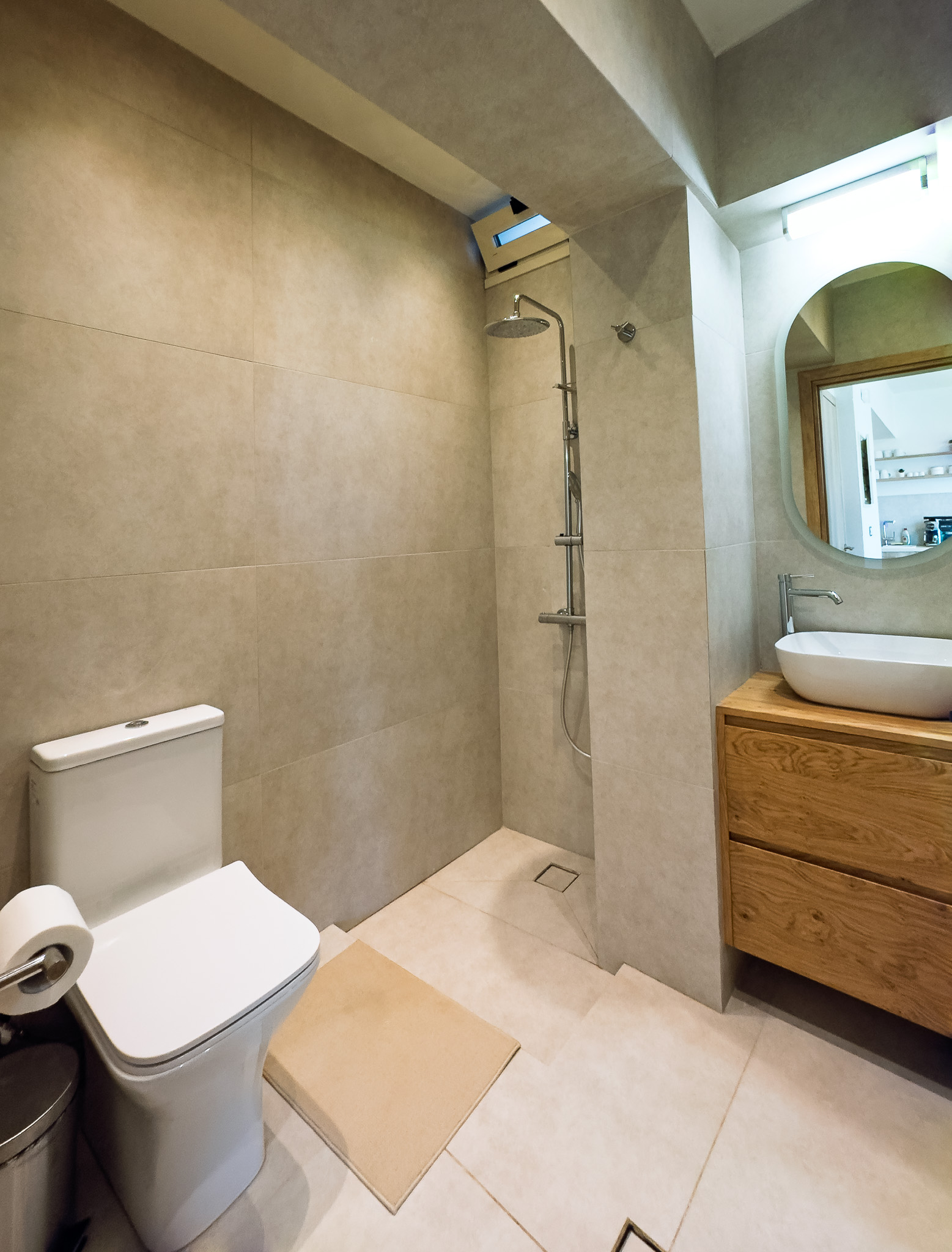 Bathroom with walk-in shower, sink, and mirror