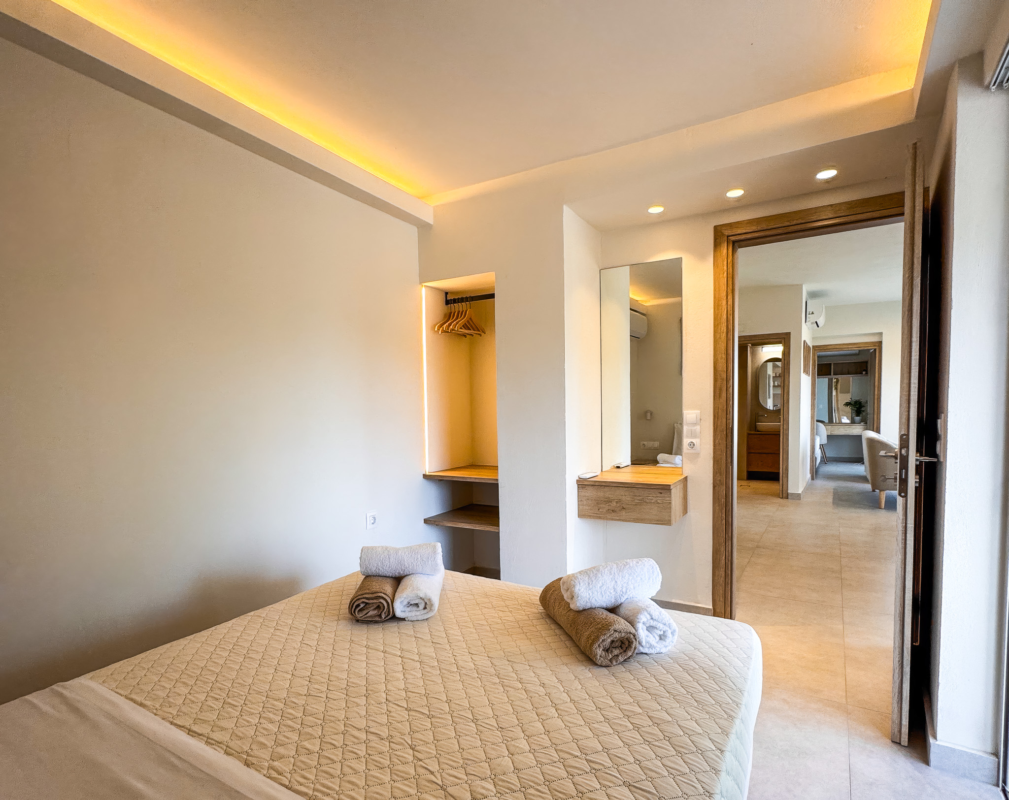 Bedroom with balcony light and garden wall outside